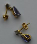 A good pair of tanzanite and diamond drop earrings
