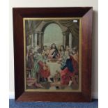 A rosewood framed needlework of a religious scene.