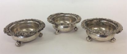 A good set of three embossed salts with ball decor