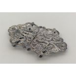 A small pierced silver two part nurse's buckle. Bi