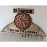 An advertising rack for "Bowes Seal Fast Tyre and