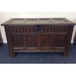 An Antique four panel coffer with hinged top and p
