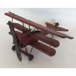 A red painted Focker tri-plane, Red Baron tin plat