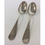 A pair of Sterling silver tablespoons decorated with flow