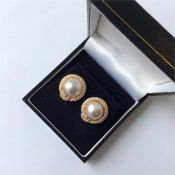 A pair of large 18 carat pearl and diamond circula