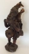 A tribal carved wooden African figure. Approx. 45