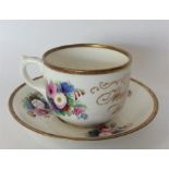 A good souvenir christening cup and saucer with gi