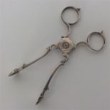 A pair of Georgian silver sugar scissors of typica