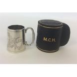 An Edwardian silver tapering mug contained within a fitte