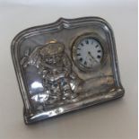 An unusual novelty silver mounted clock in the for