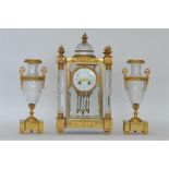 A good quality French clock garniture with white e