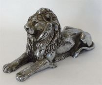 A large figure of a seated lion with outstretched