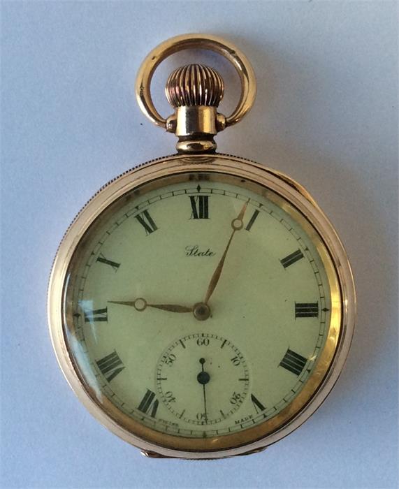 A gilt metal American pocket watch with white enam