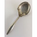 A good Georgian silver bright cut caddy spoon. Birmingham.