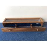 A small oak mounted display case with glass top. E