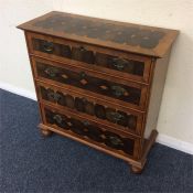 A miniature Continental chest of four drawers with