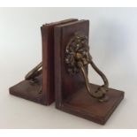 A pair of leather and brass mounted bookends. Est.