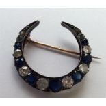 A good sapphire and diamond brooch in the form of