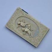 A good quality carved ivory notepad decorated with