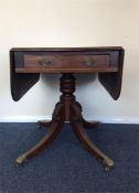 A mahogany single pedestal breakfast table with dr