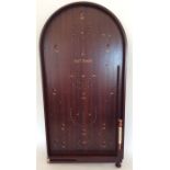 A mahogany bagatelle game. Est. £20 - £30.