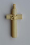 A large carved ivory cross mounted with a cherub t