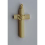 A large carved ivory cross mounted with a cherub t