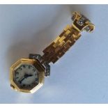 A lady's 18 carat cocktail watch inset with diamon