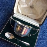 A good boxed silver porringer together with matchi