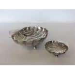 A large silver shell sweet dish together with a similar s