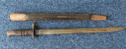 A cast iron mounted bayonet in sheath. Est. £25- £