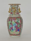 A decorative Canton vase with gilt rim and figures