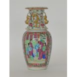 A decorative Canton vase with gilt rim and figures