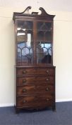 A Georgian mahogany bookcase on bracket feet. Est.