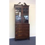 A Georgian mahogany bookcase on bracket feet. Est.