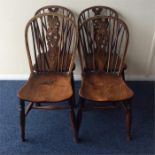 A good set of four Antique wheel back chairs on tu