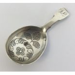 An attractive silver fiddle pattern caddy spoon, the bowl