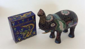 A Cloisonné figure of an elephant together with a