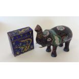 A Cloisonné figure of an elephant together with a