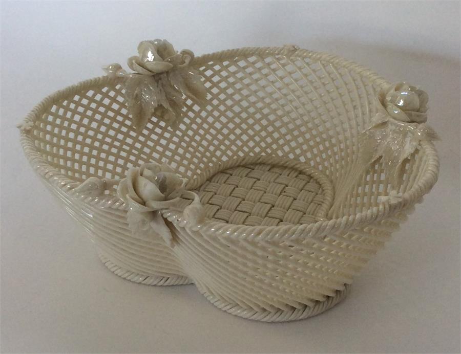 BELLEEK: An attractive basket decorated with flowe