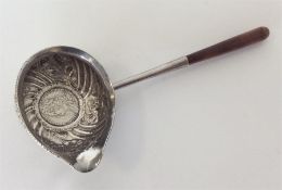 A Georgian toddy ladle with coin inset. Est. £25 -