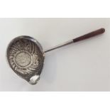 A Georgian toddy ladle with coin inset. Est. £25 -