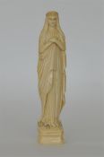 A large Antique carved ivory figure of The Virgin