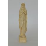 A large Antique carved ivory figure of The Virgin