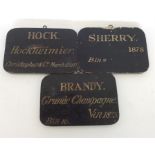 A group of three unusual wooden bin labels depicti
