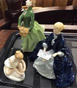 Three Royal Doulton figurines.