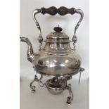 A large heavy Georgian style silver kettle on stan