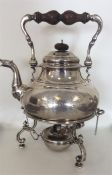 A large heavy Georgian style silver kettle on stan