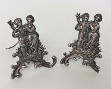 A pair of good quality silver menu holders depicti