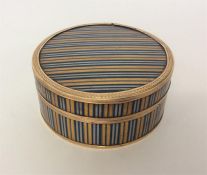 An attractive yellow and blue enamelled circular b